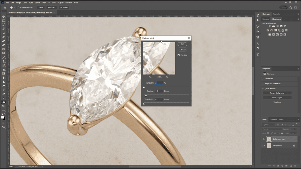 A marquise-cut diamond in a rose gold solitaire setting, photographed in the course, open in Photoshop during the Image Sharpening lesson: bright and dark facets alternate across the crown and the metal shows a smooth gradient.