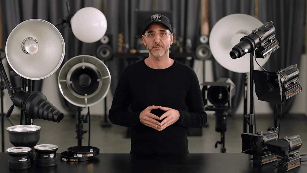 Ivan Moshe in his studio surrounded by the continuous studio lights used in the course, from the first lesson of the Lighting chapter.