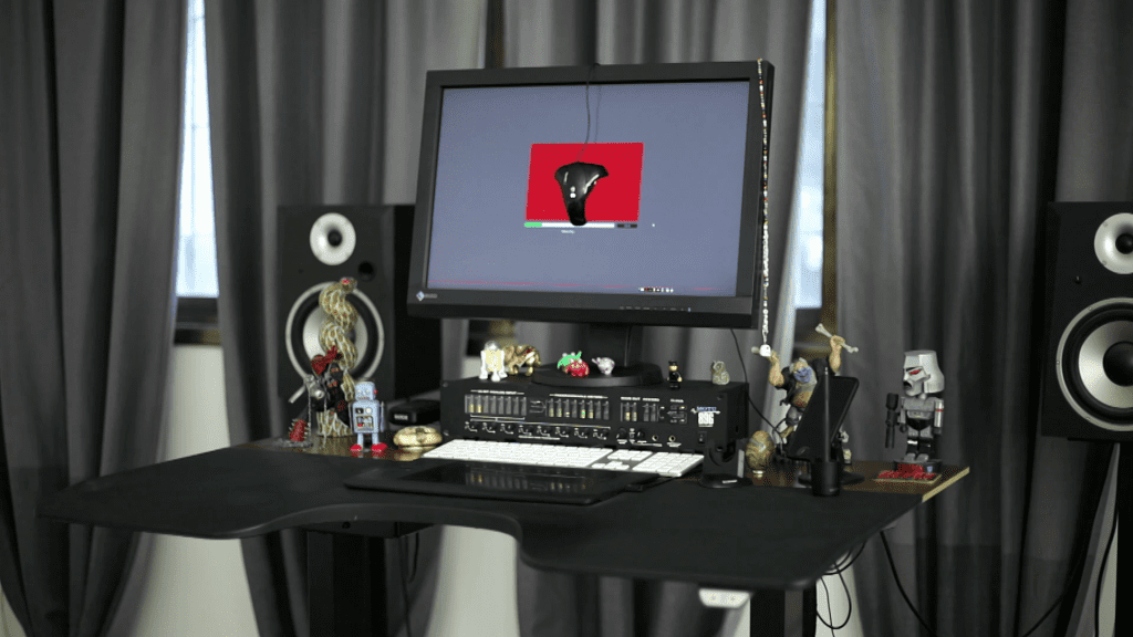 The retouching workstation in Ivan Moshe's studio with a reference image on the main monitor, from the Monitor Calibration lesson of the course.