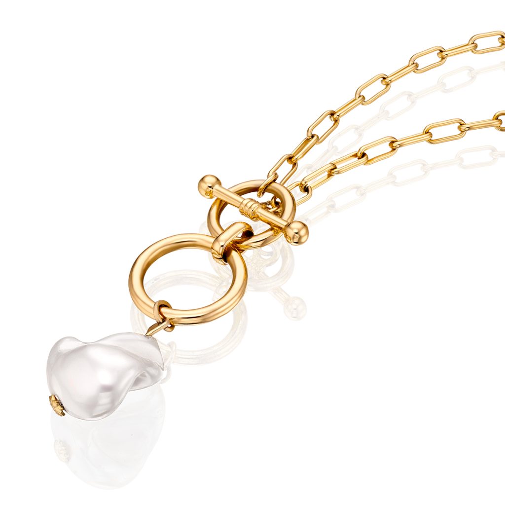 Gold chain necklace with a toggle clasp and pearl