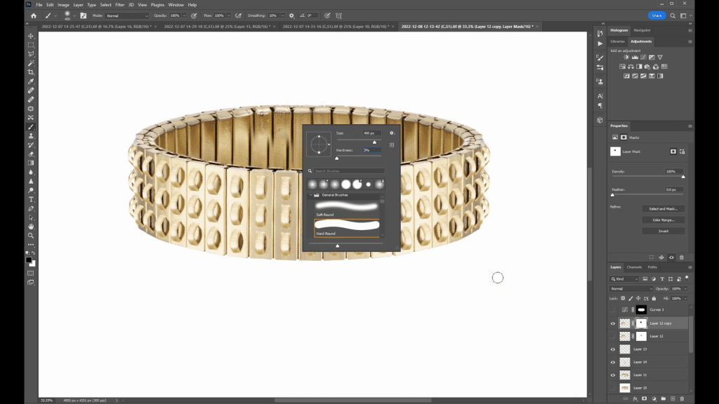 A wide gold studded bracelet open in Photoshop during the Bracelet Retouching lesson of the course, with the brush settings panel open over the image.