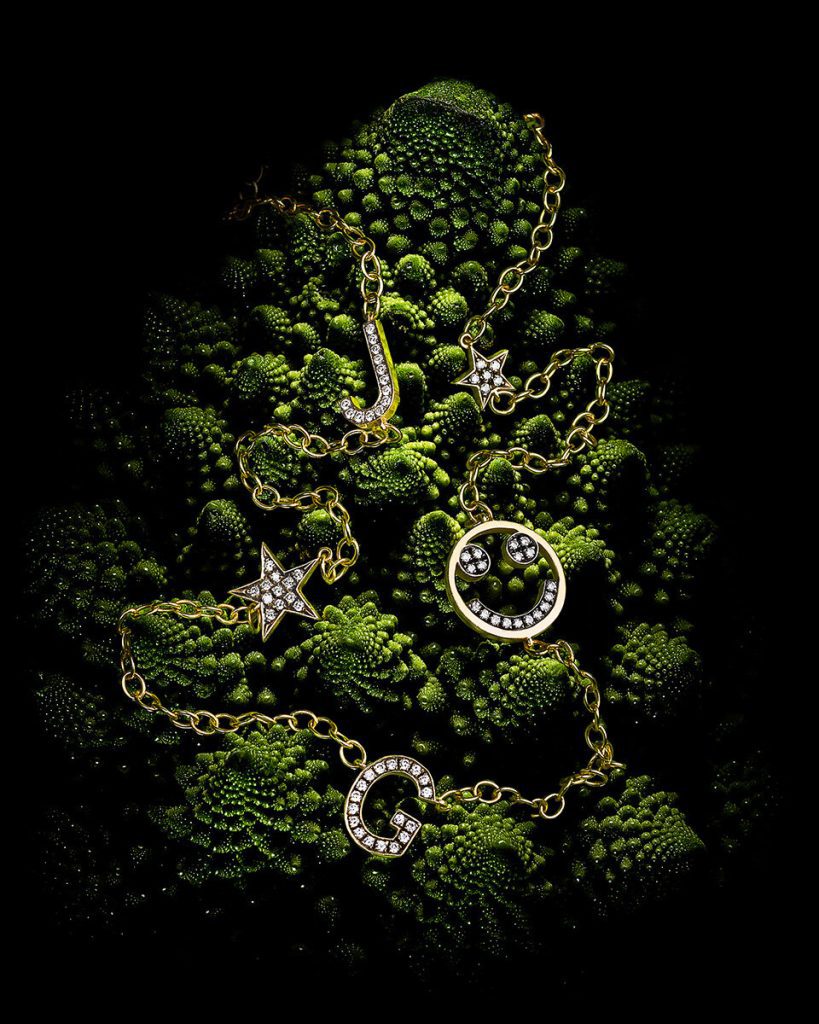 Jewelry resting on green romanesco
