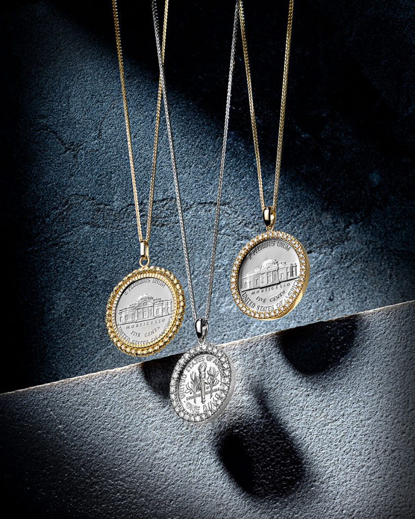 Coin pendants on textured stone